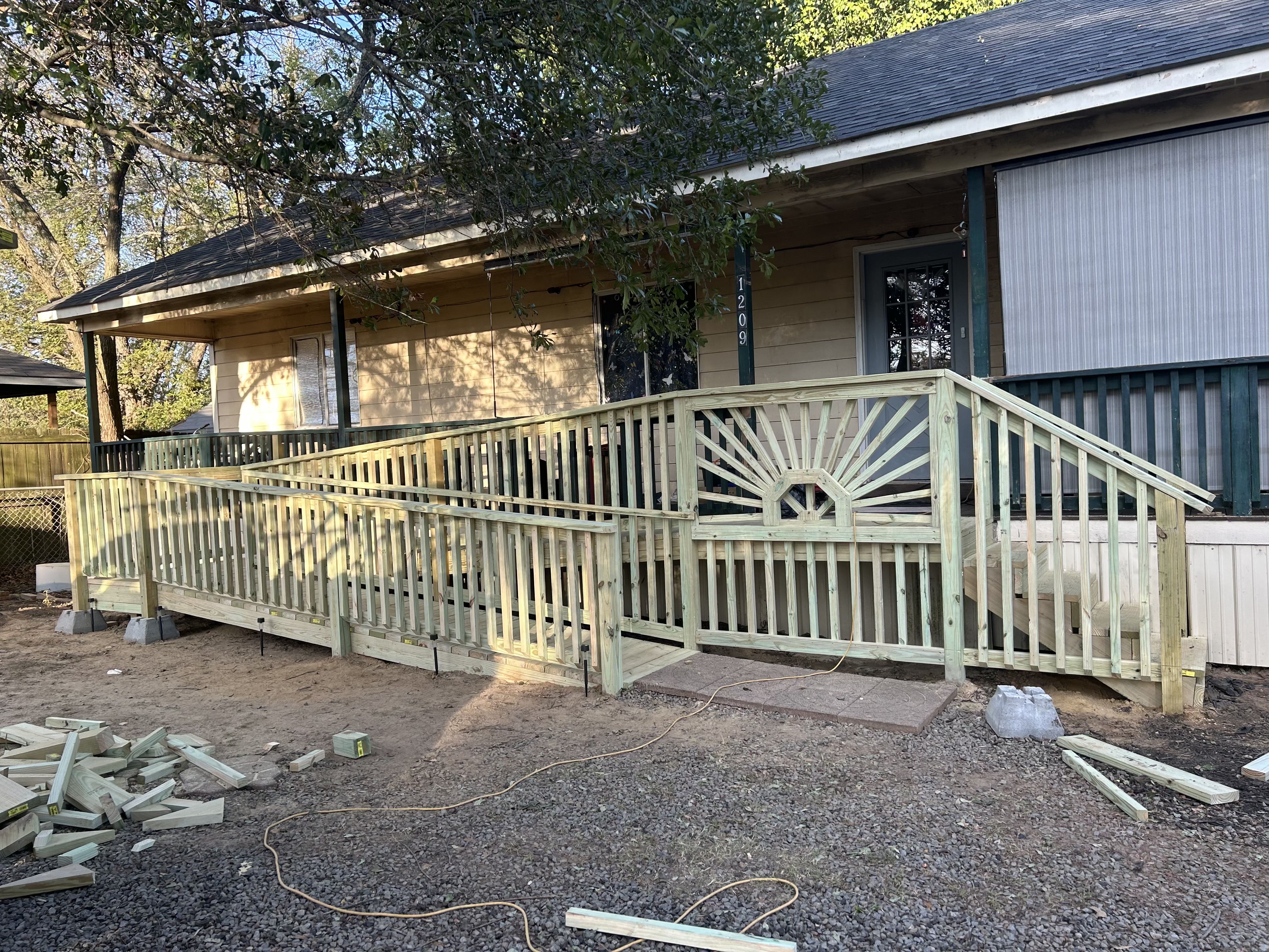 Custom porch ramp with sunburst railing